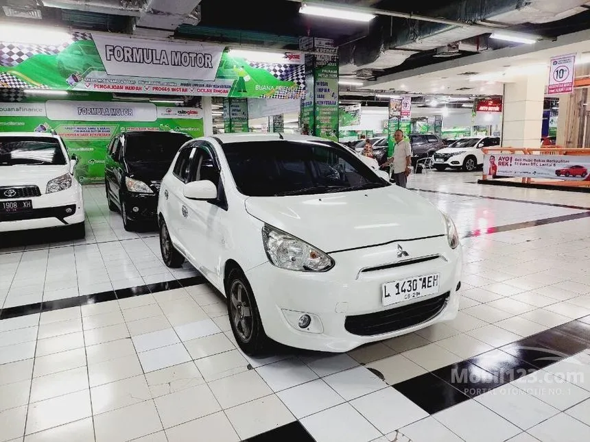 Jual Mobil Mitsubishi Mirage 2014 EXCEED 1.2 di Jawa Timur Automatic Hatchback Putih Rp 110.000.000