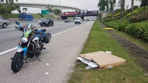 Lucky Biker Narrowly Avoids Accident With AC Unit