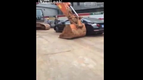 Company Uses An Excavator To Deal With Illegal Parking Problem